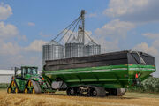 Brent 3298 Avalanche still in front of grain bins